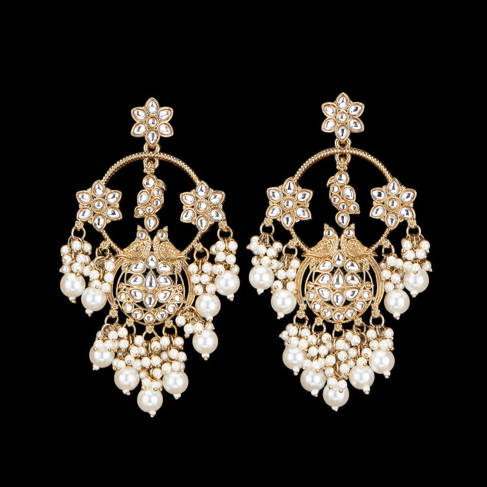 Kundan, Pearl Jhumka earrings.