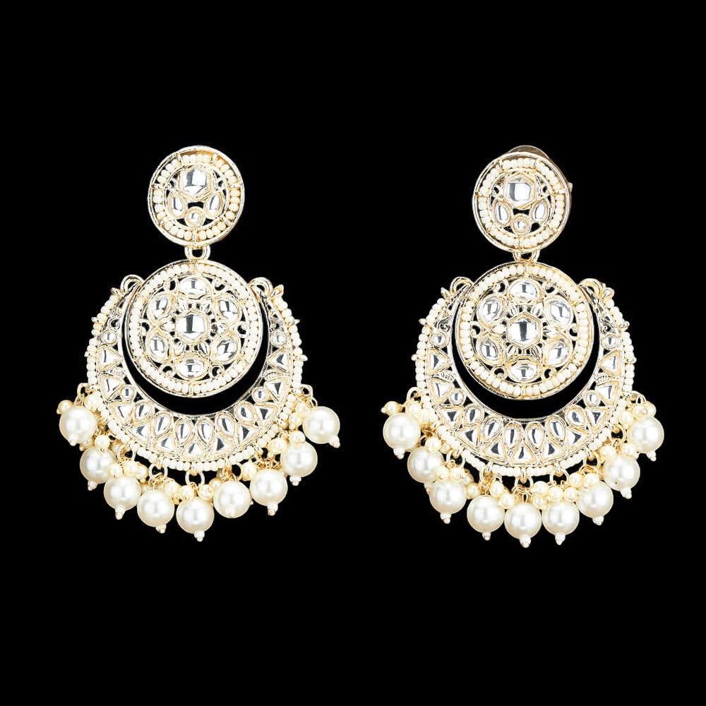 Kundan, Pearl Jhumka earrings.