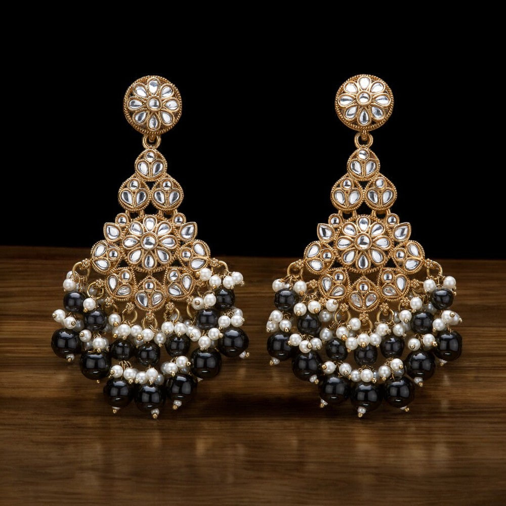 Kundan, Pearl Jhumka earrings.