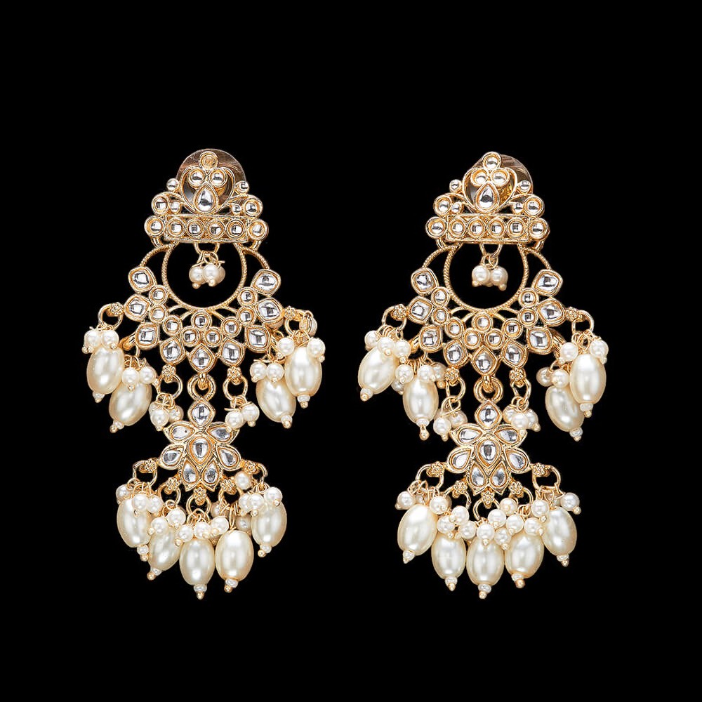 Kundan, Pearl Jhumka earrings.