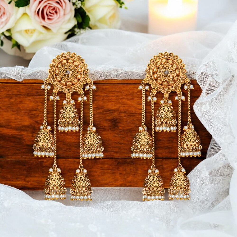 Golden Jhumka earrings.