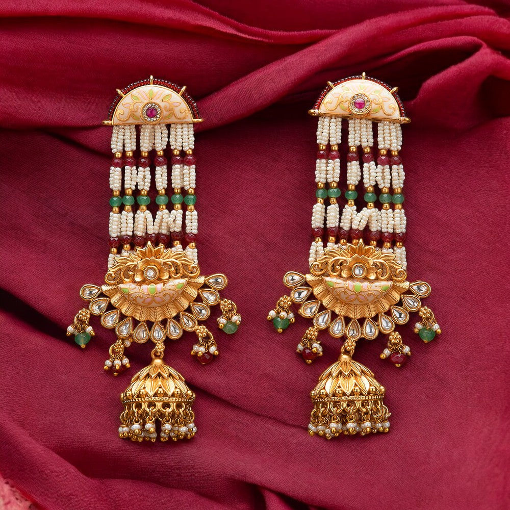 Golden Jhumka earrings.