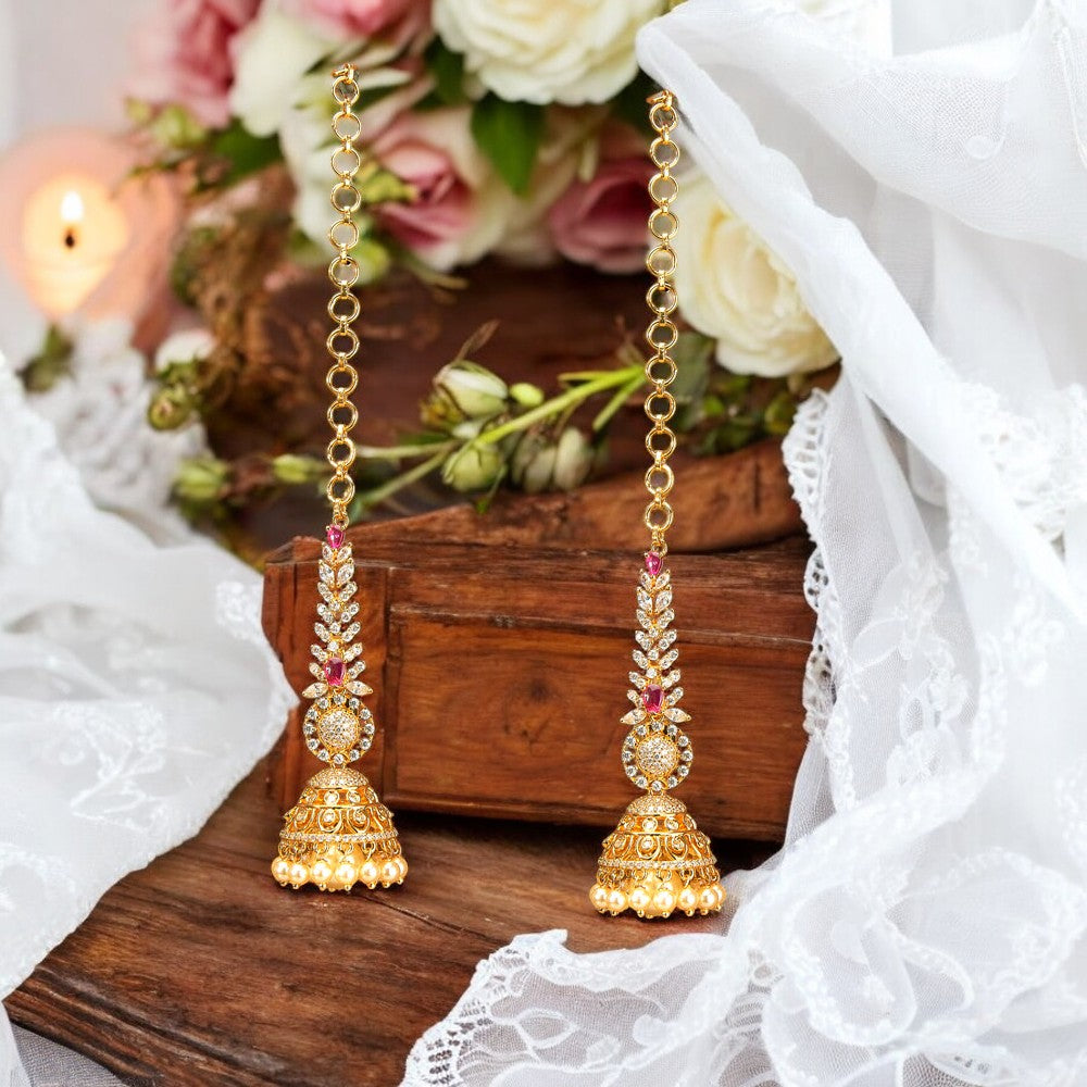 Golden Jhumka earrings.