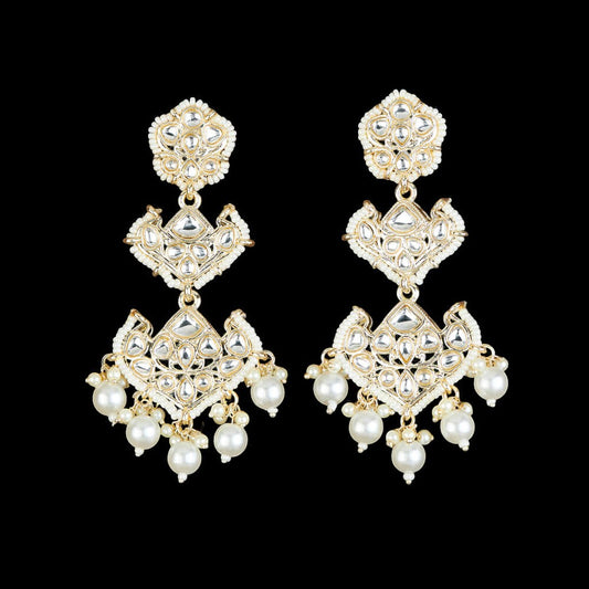 Kundan, Pearl Jhumka earrings.