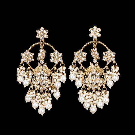 Kundan, Pearl Jhumka earrings.