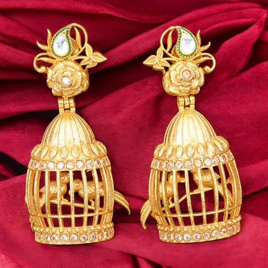 Golden bird cage, kundan Jhumka earrings.