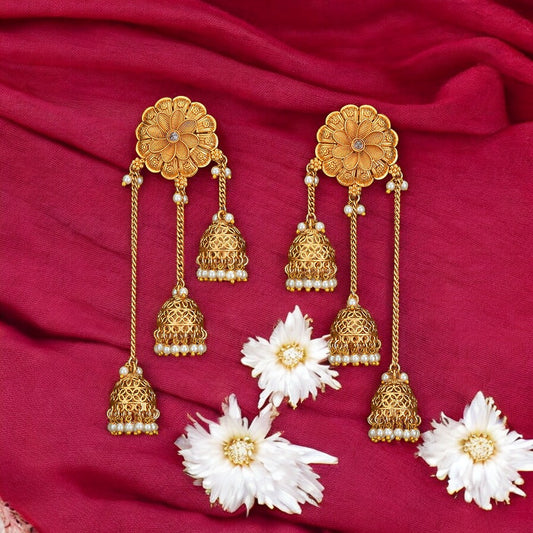 Golden Jhumka earrings.