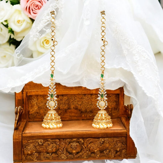 Golden Jhumka earrings.